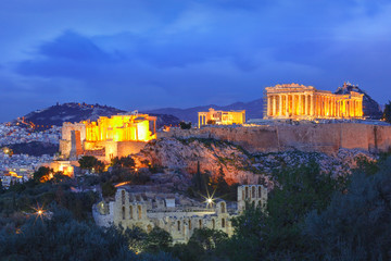 Fototapeta na wymiar Aerial view of the Acropolis Hill, crowned with Parthenon during evening blue hour in Athens, Greece