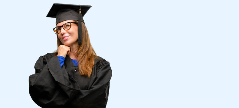 Senior graduate student woman thinking and looking up expressing doubt and wonder isolated blue background