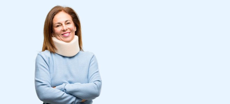 Injured Woman Wearing Neck Brace Collar With Crossed Arms Confident And Happy With A Big Natural Smile Laughing Isolated Blue Background