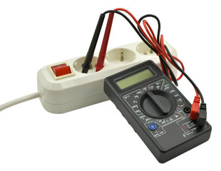 Digital multimeter and electric outlet isolated on white