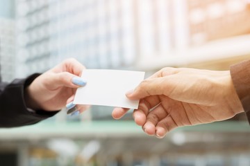 business woman in hand hold show business cards blank white card mock up filing give to connect business man contacts. Business branding concept.