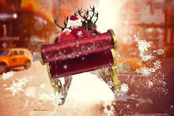 Santa flying his sleigh against blurry new york street