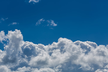 Naklejka na ściany i meble Clouds against the background of the blue sky