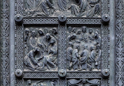 Fragment of Bremen's Cathedral Metalic Door with decorations depicting Jesus washing the feet of the disciples and Last supper, Germany. Reliefs were designed by Peter Fuchs in 1891.