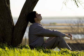 young man turns to God with hope, the concept of faith and spirituality