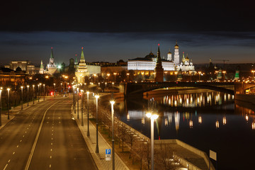 Fototapeta na wymiar Moscow Kremlin at night on the background of Prechistenskaya embankment
