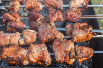 Yummy pork meat cooked outdoor on smouldering carbons
