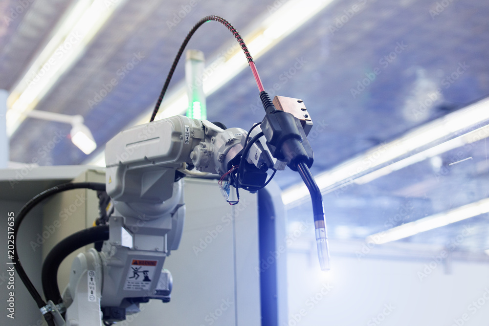 Aufkleber Automatic welding robot in a modern factory in operation. 