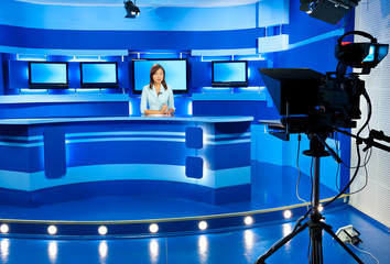 television newscaster at blue TV studio