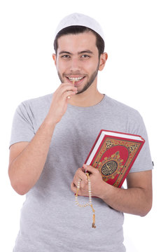 brush the tooth with the miswak