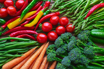 Vegetables background. Carrots, tomatoes, asparagus, broccoli, chilli pepper, green beans. Top view. Organic food.
