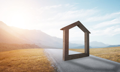 Conceptual background image of concrete home sign on asphalt road