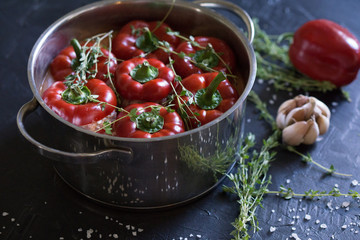 Traditional Bulgarian or Hungarian food: paprika stuffed with meat and vegetables in tomato and sour cream sauce,
