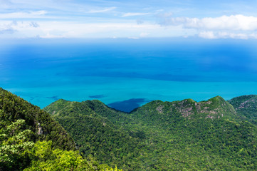 Fototapeta na wymiar Mountain covered jungle on tropical island in sea in Malaysia, Langkawi