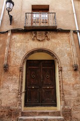 Fototapeta na wymiar Old facade and entrance of majestic house in Alcaraz, Albacete province, Spain