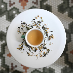 Chamomile tea on circular table
