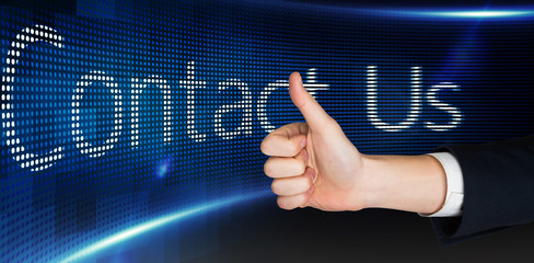 Plakat Hand showing thumbs up against contact us on digital screen