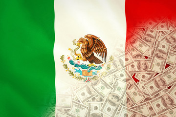 Pile of dollars against digitally generated mexican national flag