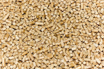 Wood pellets background. The cat litter. Biofuels.
