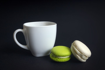 Cupcake with pink cream and cup of tea on wooden table indoors