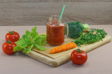 Fresh vegetable cocktail from tomatoes, broccoli, spinach and carrots