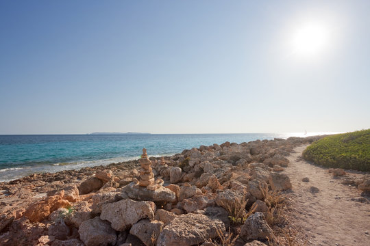 Cap de Ses Salines, Mallorca - A walk during sundown at the rocky beach of Ses Salines