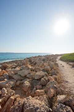 Cap de Ses Salines, Mallorca - Beautiful warm light and a lonely path at the beach of Ses Salines
