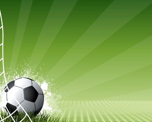 Football with striped green background