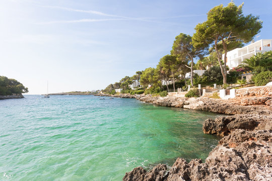 Cala d'Or, Mallorca - A rocky coastline and turquoise water at the beach of Cala d'Or