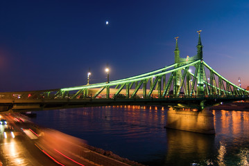 Fototapeta na wymiar Liberty bridge in Budapest at night. Blurred traffic lights