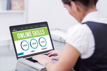 Online skills interface against businesswoman using laptop