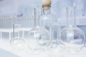 Glass laboratory tubes for collecting samples and conducting tests close-up on a special plastic rack. 