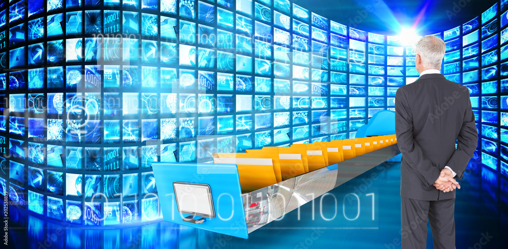 Poster rear view of mature businessman posing against composite image of cloud computing drawer
