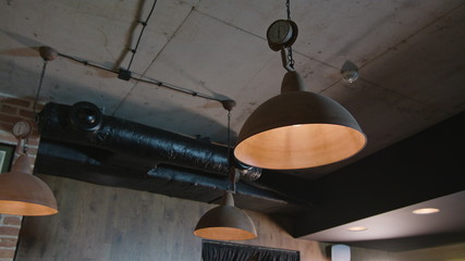 Hanging lamps with dim light in a cafe shop. Close-up shop