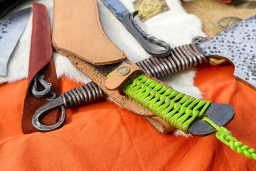 The handle of the knife made of plaiting in the form of weaving