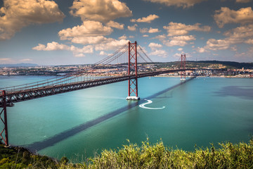 The 25 de Abril Bridge is a bridge connecting the city of Lisbon to the municipality of Almada on the left bank of the Tejo river, Lisbon