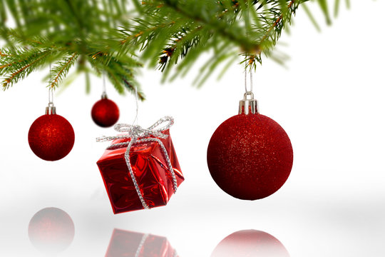 Composite image of Decorations on tree on white background