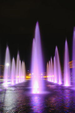 colored water fountain at night