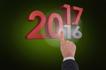 Businessman touching invisible screen against green background with vignette