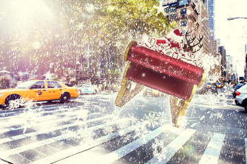 Santa flying his sleigh against new york street