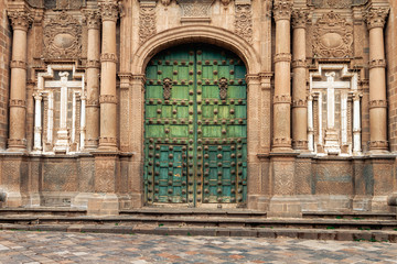 Fototapeta na wymiar Gate of the Temple of the Company of Jesus in Cusco (Peru) in front of the main square