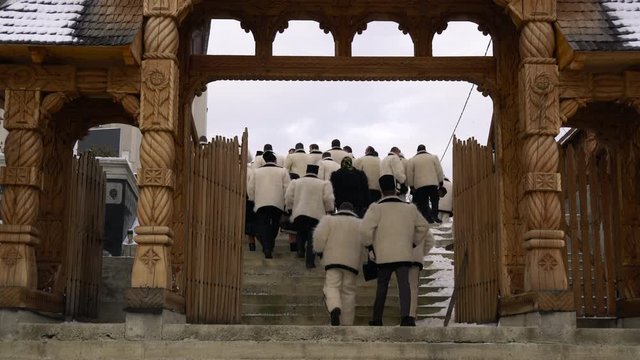 Peasants going up the stairs in Maramures