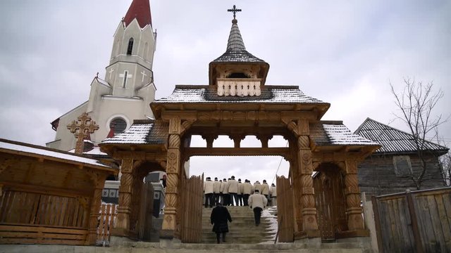 Traditional wooden gate near a church in Maramures
