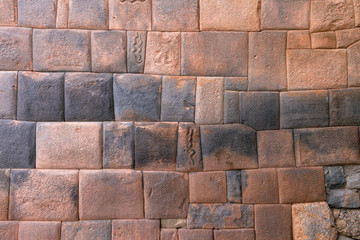 Engravings of snakes on stones of the walls of the street of the 7 snakes in Cusco (Peru)