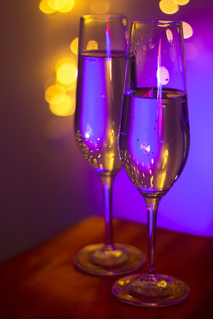 Champagne glass in disco party bar