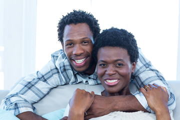 Obraz premium Happy couple hugging at home