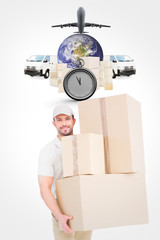 Delivery man carrying cardboard boxes against logistics graphic