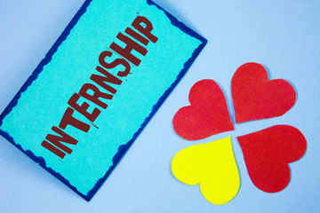 Text sign showing Internship. Conceptual photo Student or trainee who works in a company to obtain experience written on Sticky Note paper on plain background Paper Love Hearts next to it.