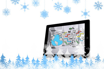 Snowflakes and fir trees against earth brainstorm on tablet screen