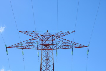 high voltage power lines on background of blue sky